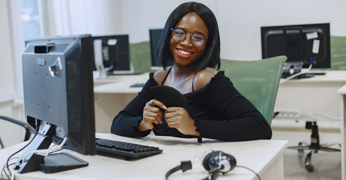 An African team working at computers in a technology office.